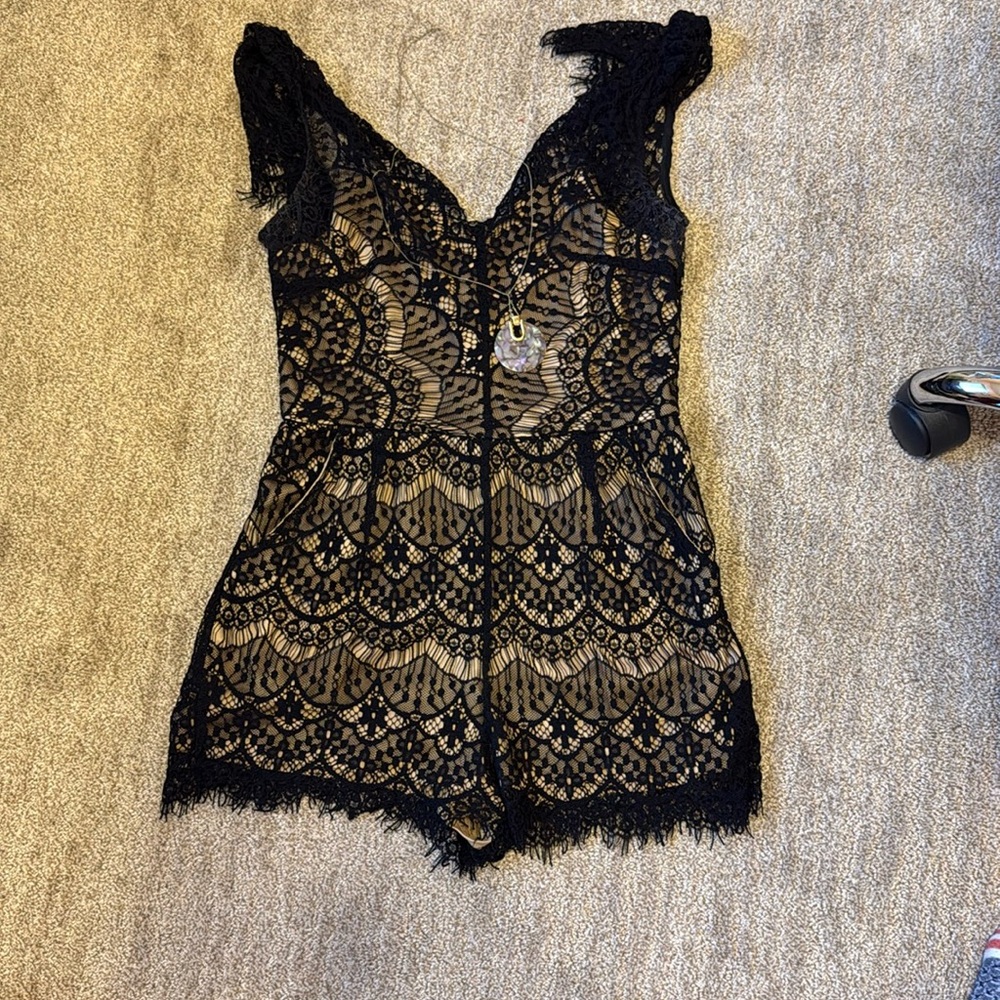Lace jumpsuit from Aakaa. Has lining in jumpsuit.